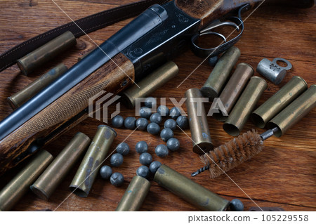 Hunting shotgun with brass cases and accessories for cartridge reloading. Hunting shotgun with brass cases and accessories for cartridge reloading. 105229558