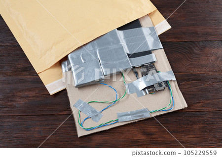 Mail bomb. Improvised Explosive Device with plastic explosive C-4 and cell phone module in envelope 105229559