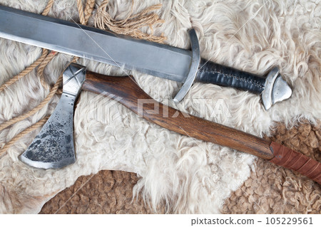 Viking battle axes on sheep fur Viking battle axes on sheep fur 105229561