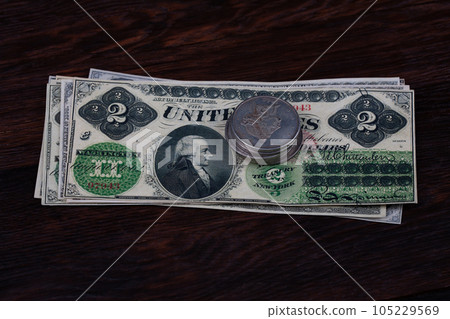 Old west US banknotes and silver certificates with silver dollar coins Old west US banknotes and silver certificates with silver dollar coins 105229569