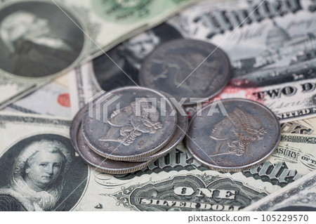 Old west US banknotes and silver certificates with silver dollar coins Old west US banknotes and silver certificates with silver dollar coins 105229570