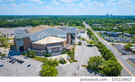 Aerial Allen Country War Memorial Coliseum with airplane and distant downtown Fort Wayne 105229607