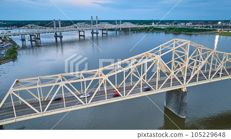 White gold truss bridge aerial at blue sunset over Ohio River White gold truss bridge aerial at blue sunset over Ohio River 105229648