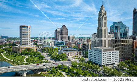 Aerial of green parks and sidewalks on outskirts of downtown Columbus Ohio with skyscrapers Aerial of green parks and sidewalks on outskirts of downtown Columbus Ohio with skyscrapers 105229653