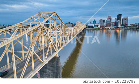 Rose gold truss bridge over Ohio River waterway leading to heart of downtown Louisville KY Rose gold truss bridge over Ohio River waterway leading to heart of downtown Louisville KY 105229792