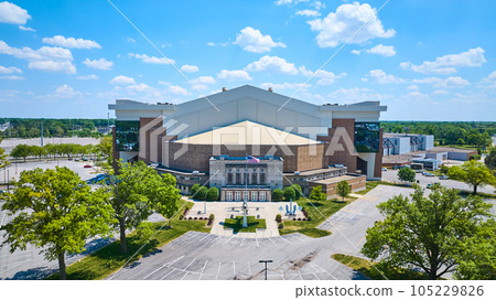 Aerial Allen Country War Memorial Coliseum with airplane and American flag and blue sky day 105229826