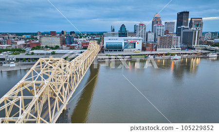 Truss bridge stretching toward downtown Louisville Kentucky blue sunset 105229852