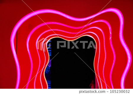 Red hallway of abstract red doors outlined in red neon lights and a black exit Red hallway of abstract red doors outlined in red neon lights and a black exit 105230032