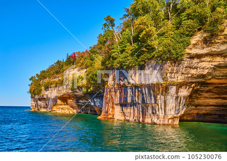 Turquoise green waters with soaring cliffs of pictured rocks national park Turquoise green waters with soaring cliffs of pictured rocks national park 105230076