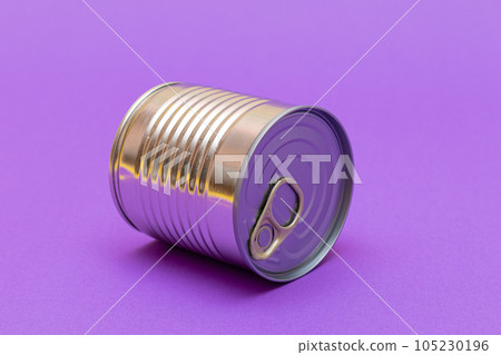 Unopened Tin Can with Blank Edge on Violet Background Unopened Tin Can with Blank Edge on Violet Background 105230196