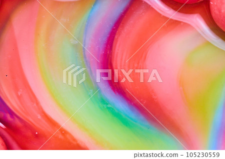 Abstract heart curved swirl of candy colors as skittles sugar mixes with water in background asset Abstract heart curved swirl of candy colors as skittles sugar mixes with water in background asset 105230559