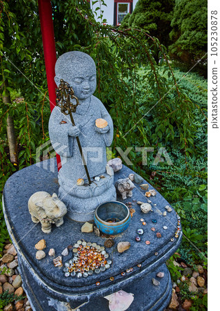 Statue with small donations for Tibetan Mongolian Buddhist zen and meditation  105230878