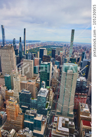 Looking out at Manhattan and New York City skyscrapers with Central Park in distance from above 105230955