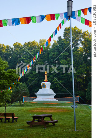 Prayer flags by Chorten monument shrine of Buddhist center 105230982