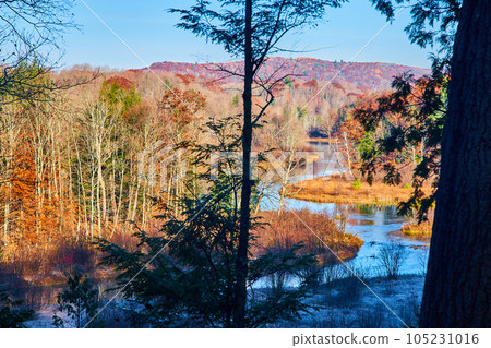 River winding through Michigan in late fall with muted colors 105231016