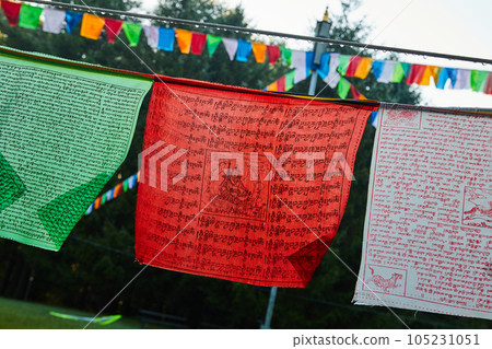 Rope with green, red, and white Tibetan Mongolian Buddhist prayer flags 105231051