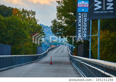 Endless long jogging bridge through woods 105231298