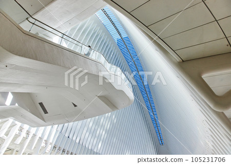 Viewing platform overlooking clean white huge interior of modern subway with ribs leading to skylight spine Viewing platform overlooking clean white huge interior of modern subway with ribs leading to skylight spine 105231706