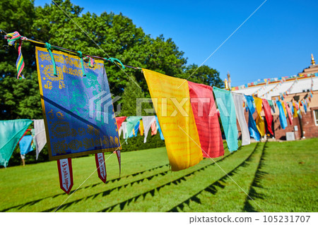 Rows of prayer flags on ropes at Tibetan Mongolian Buddhist Cultural Center Rows of prayer flags on ropes at Tibetan Mongolian Buddhist Cultural Center 105231707