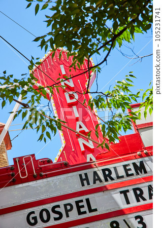 Indiana state red sign on theater through leaves 105231741