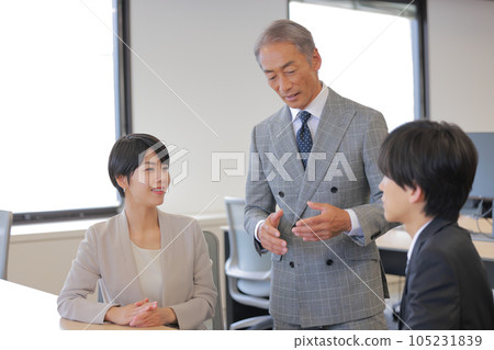 Three business people having a meeting_1 Three business people having a meeting_1 105231839