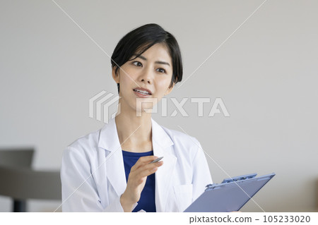 Image of a young female doctor giving an interview Image of a young female doctor giving an interview 105233020