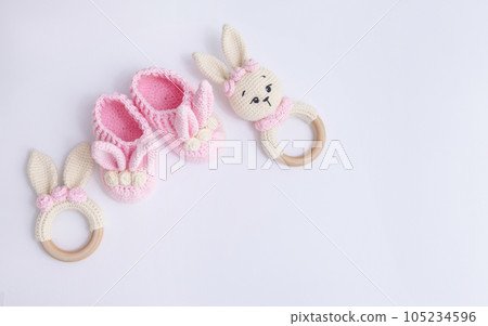 Cute wooden baby toys on a white background. Eco accessories and teethers for newborns. Blank space for text. Flat plan, top view. High quality photo Cute wooden baby toys on a white background. Eco accessories and teethers for newborns. Blank space for text. Flat plan, top view. High quality photo 105234596