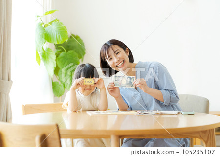 Parents and children studying money 105235107