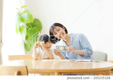 Parents and children studying money Parents and children studying money 105235108