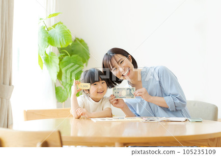 Parents and children studying money Parents and children studying money 105235109