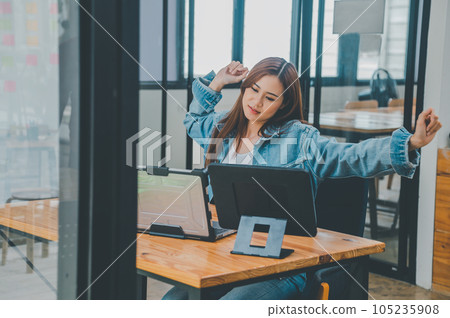 Female programmers are stretching oneself and relaxing after working and planning to work on programming, software coding and web design. Concept technology development. 105235908