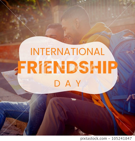 International friendship day text with happy diverse male friends reading map in street 105241847