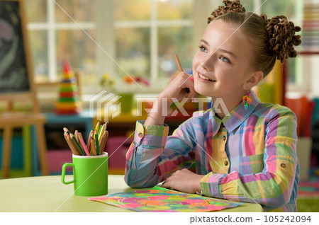 little girl doing homework 105242094