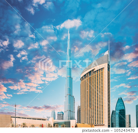 View of hotel Address Dubai Marina, Dubai mall and Burj Khalifa against dramatic sky. View of landmarks of residential district in Dubai Marina. Burj Khalifa, known as the Burj Dubai with a total 105243470