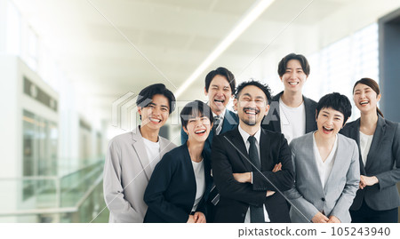 Group of office workers laughing in the office 105243940