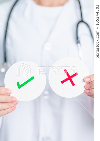 Doctor show Wrong symbol paper. True and false, accept and rejected, evaluation, Diagnosis, Vote, Poll, Yes or No, Health, Medical and Survey concepts Doctor show Wrong symbol paper. True and false, accept and rejected, evaluation, Diagnosis, Vote, Poll, Yes or No, Health, Medical and Survey concepts 105244303