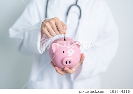 Doctor holding piggy bank and putting coin. and Healthcare cost, Money Saving, Health Insurance, Medical, Donation and Financial concepts Doctor holding piggy bank and putting coin. and Healthcare cost, Money Saving, Health Insurance, Medical, Donation and Financial concepts 105244316