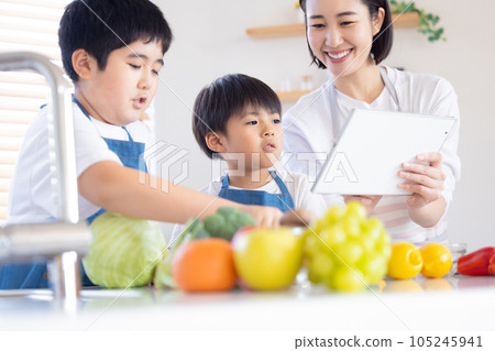 brother and mother cooking brother and mother cooking 105245941