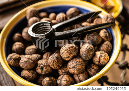Walnuts and nutcracker Walnuts and nutcracker 105249935