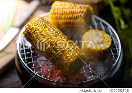 Grilled corn Fresh corn grilled over charcoal Grilled corn Fresh corn grilled over charcoal 105250238