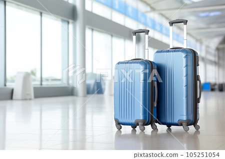 Two blue suitcases in airport. Vacation travel summer luggage flight tour. Business journey trip plane panorama hall windows background photo 105251054