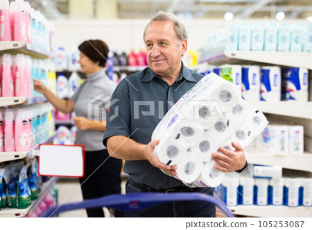 Mature man choosing packaged piece of meat in grocery store Mature man choosing packaged piece of meat in grocery store 105253087