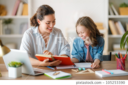 Girl doing homework or online education. 105253390