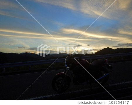 Sunrise, windmills and motorcycles Sunrise, windmills and motorcycles 105254147