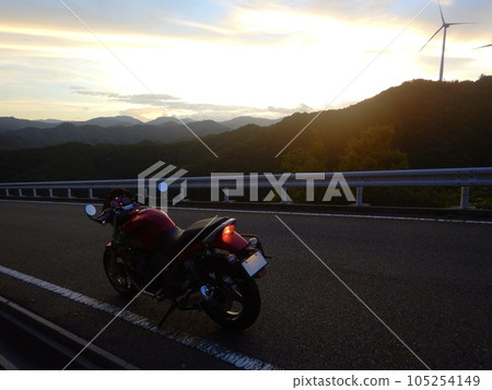 Sunrise, windmills and motorcycles Sunrise, windmills and motorcycles 105254149