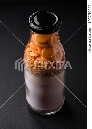 Ingredients for making delicious sweet pancakes that are portioned in a bottle 105254312