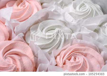 Delicious sweet multi-colored marshmallow on a dark concrete background 105254383