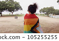 Woman with LGBT flag in the park on pride parade 105255255