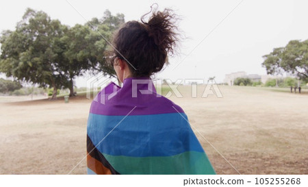 Woman with LGBT flag in the park on pride parade Woman with LGBT flag in the park on pride parade 105255268