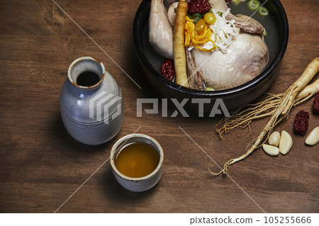 korean traditional food samgyetang, chicken soup with ginseng with korean traditional alcohol korean traditional food samgyetang, chicken soup with ginseng with korean traditional alcohol 105255666
